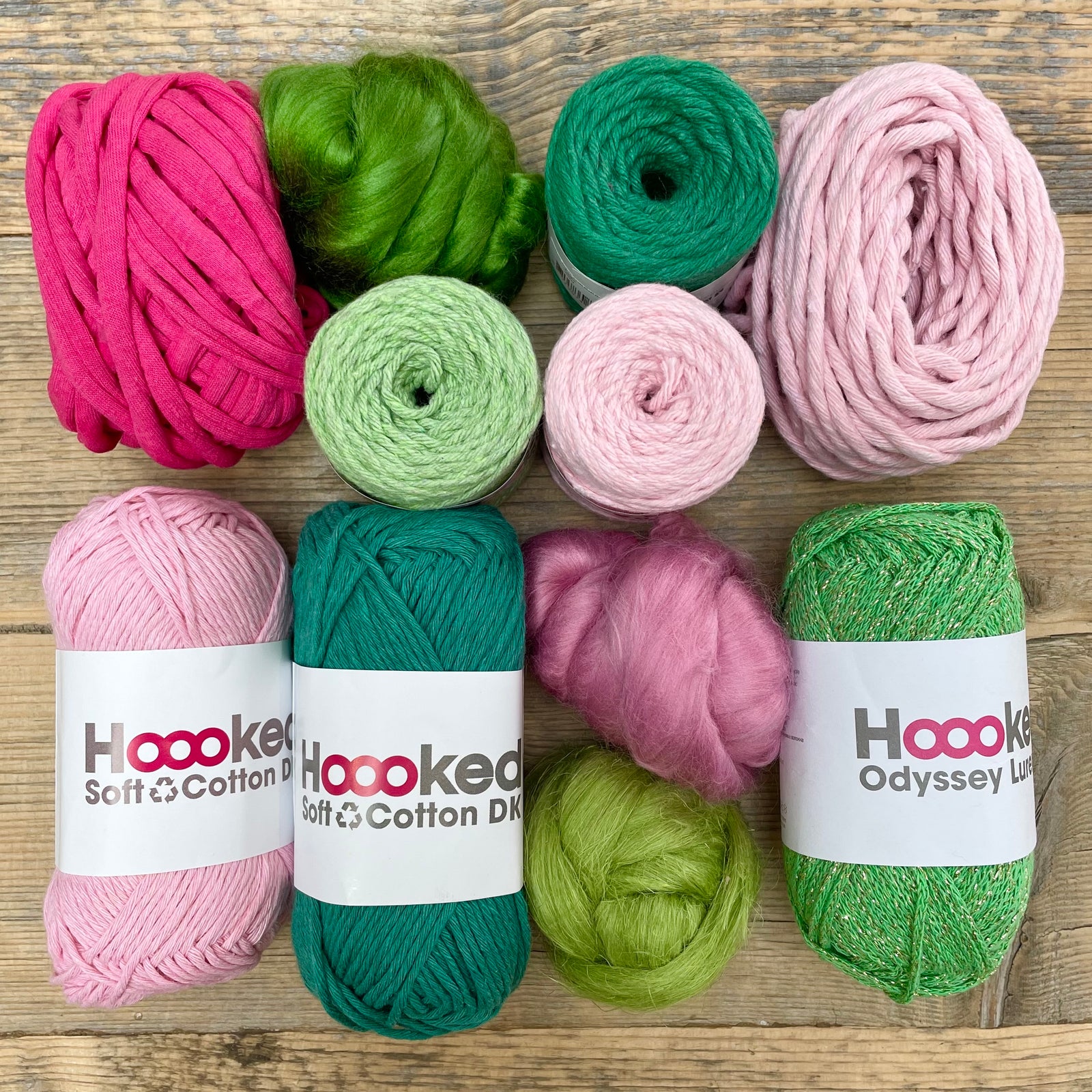 A multi-coloured yarn pack is displayed with an assortment of weaving yarn and fibre suitable as tapestry yarn, craft yarn, fiber art yarn and more. The colour way for these weaving supplies is 'Blossom'.