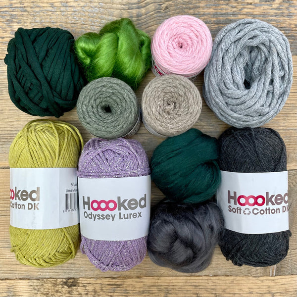 A multi-coloured yarn pack is displayed with an assortment of weaving yarn and fibre suitable as tapestry yarn, craft yarn, fiber art yarn and more. The colour way for these weaving supplies is 'Highlands'.