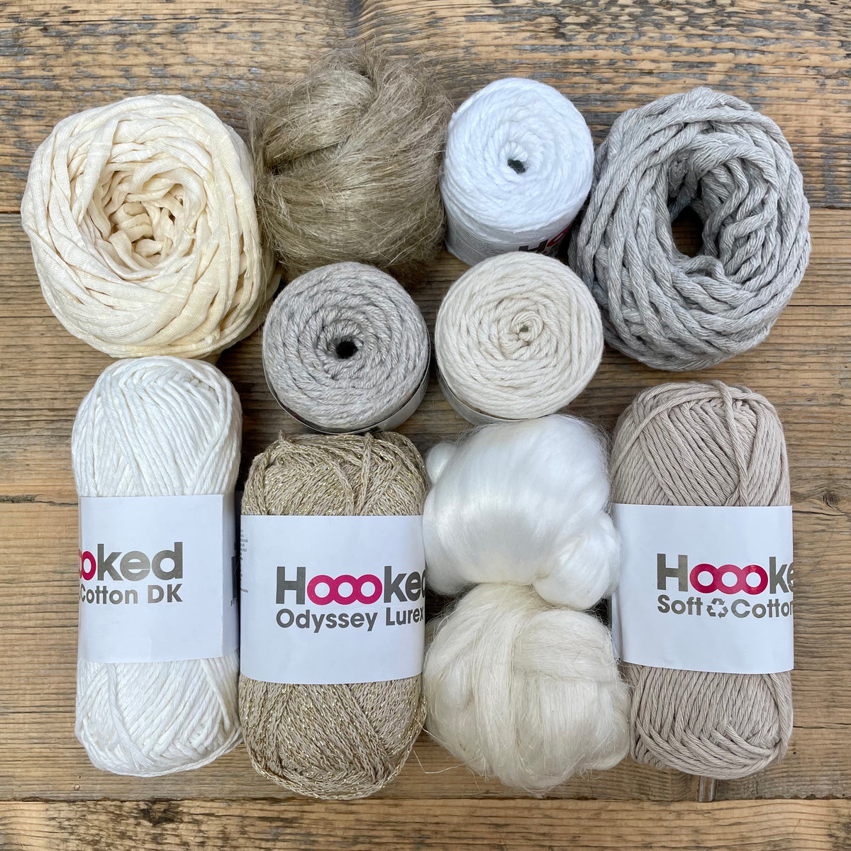 A multi-coloured yarn pack is displayed with an assortment of weaving yarn and fibre suitable as tapestry yarn, craft yarn, fiber art yarn and more. The colour way for these weaving supplies is 'Natural'.